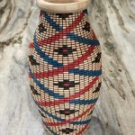 wood urn with red and blue criss cross design by john beall
