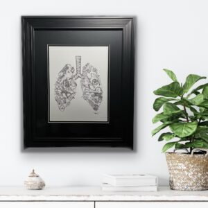 print of lungs formed by creatures with a black mat and frame