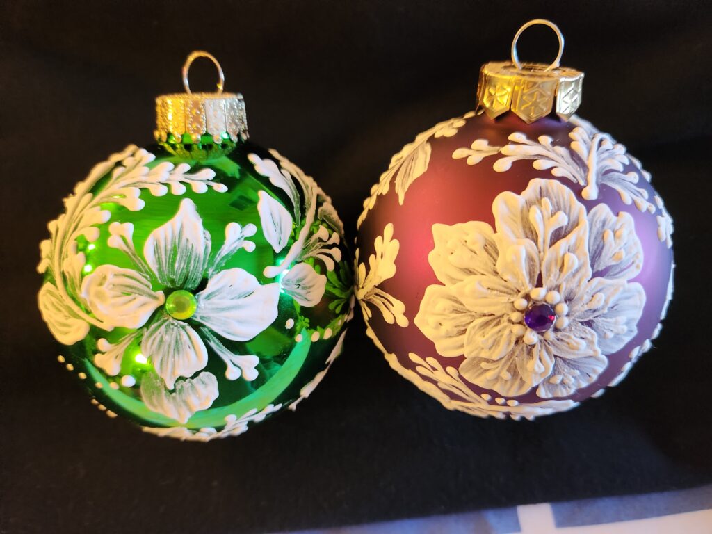 two hand painted red , green and white christmas ornaments by Gerri Zoppa