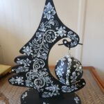 a hand painted black and white christmas ornament by Gerri Zoppa