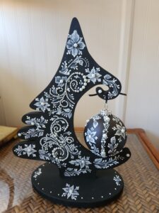 a hand painted black and white christmas ornament by Gerri Zoppa