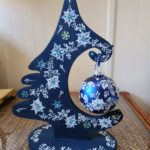 a hand painted blue and white christmas ornament by Gerri Zoppa