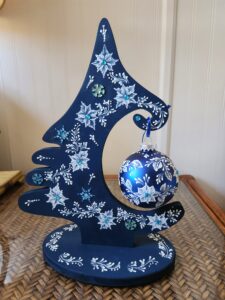a hand painted blue and white christmas ornament by Gerri Zoppa